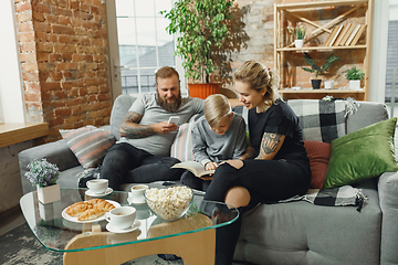 Image showing Happy family at home spending time together. Having fun, look cheerful and lovely.