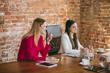 Image showing Business young caucasian woman in modern office with team