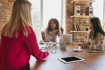 Image showing Business young caucasian woman in modern office with team