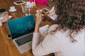 Image showing Business young caucasian woman in modern office with team