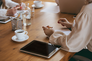 Image showing Business young caucasian woman in modern office with team