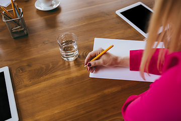 Image showing Business young caucasian woman in modern office with team