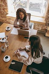 Image showing Business young caucasian woman in modern office with team