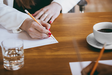 Image showing Business young caucasian woman in modern office with team