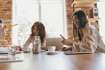 Image showing Business young caucasian woman in modern office with team