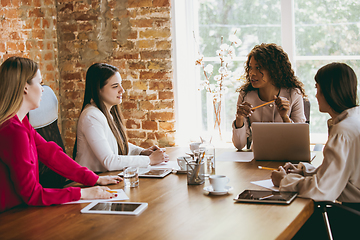 Image showing Business young caucasian woman in modern office with team