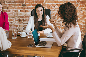 Image showing Business young caucasian woman in modern office with team