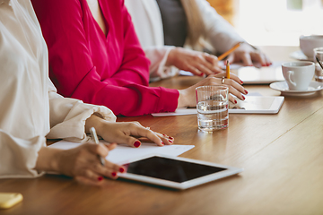 Image showing Business young caucasian woman in modern office with team