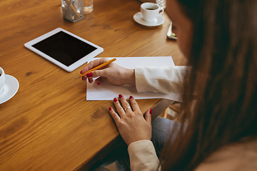 Image showing Business young caucasian woman in modern office with team