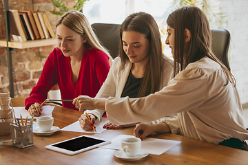 Image showing Business young caucasian woman in modern office with team