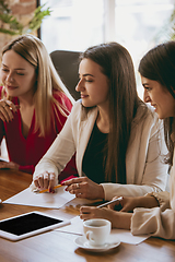 Image showing Business young caucasian woman in modern office with team