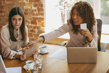 Image showing Business young caucasian woman in modern office with team