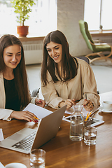 Image showing Business young caucasian woman in modern office with team