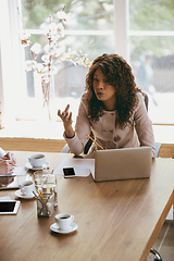 Image showing Business young caucasian woman in modern office with team