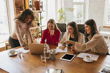 Image showing Business young caucasian woman in modern office with team