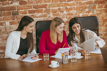 Image showing Business young caucasian woman in modern office with team