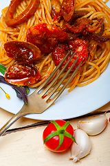 Image showing Italian seafood spaghetti pasta on red tomato sauce