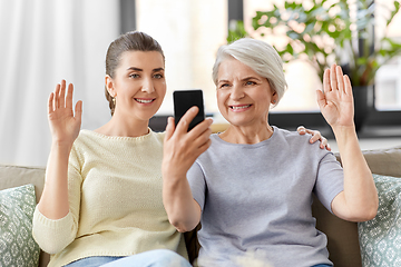 Image showing daughter and old mother having video call on phone