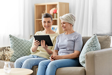 Image showing daughter and senior mother with tablet pc at home