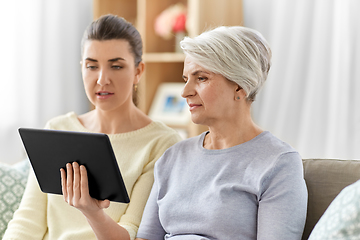 Image showing daughter and senior mother with tablet pc at home