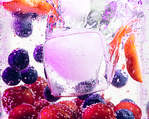 Image showing Close up view of the cold and fresh lemonade with bright berries in neon light