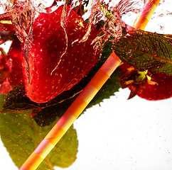 Image showing Close up view of the cold and fresh lemonade with bright berries in neon light