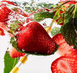 Image showing Close up view of the cold and fresh lemonade with bright berries in neon light