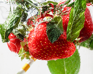 Image showing Close up view of the cold and fresh lemonade with bright berries in neon light