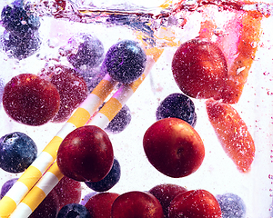 Image showing Close up view of the cold and fresh lemonade with bright berries in neon light