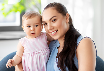 Image showing happy mother with little baby daughter at home