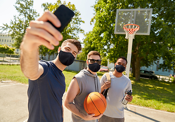 Image showing happy men taking selfie on basketball playground