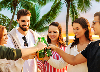 Image showing friends toasting non alcoholic drinks on beach