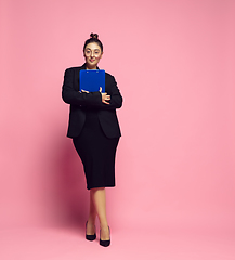 Image showing Young caucasian woman in office attire. Bodypositive female character. plus size businesswoman