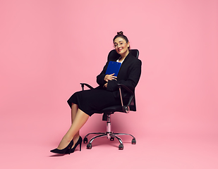 Image showing Young caucasian woman in office attire. Bodypositive female character. plus size businesswoman