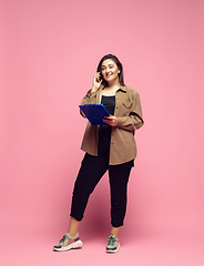 Image showing Young caucasian woman in casual wear. Bodypositive female character. plus size businesswoman