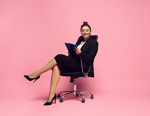 Image showing Young caucasian woman in office attire. Bodypositive female character. plus size businesswoman