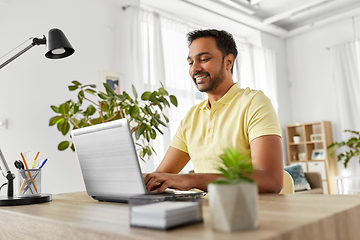 Image showing indian man with laptop working at home office