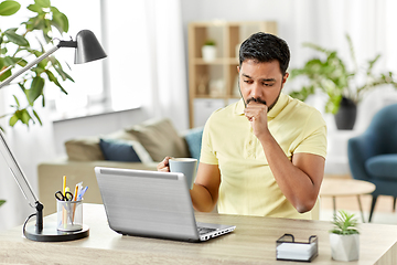 Image showing ill indian man with laptop coughing at home office