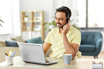 Image showing indian man with headset and laptop working at home