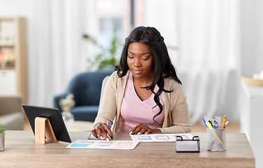 Image showing african woman working on ui design at home office