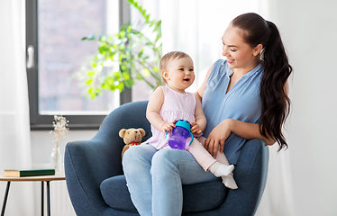 Image showing happy mother with little baby daughter at home