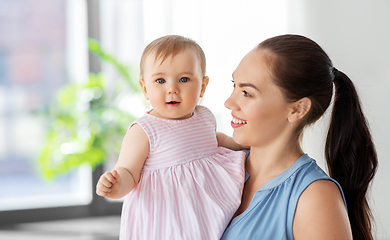 Image showing happy mother with little baby daughter at home
