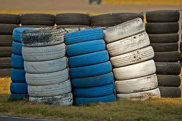 Image showing Roadside stacked tyres