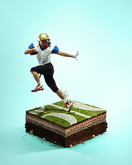 Image showing American football player on blue background above stadium layers. Professional sportsman during game playing in action and motion.