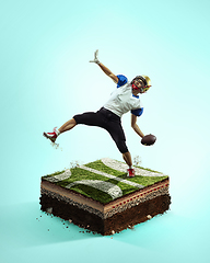 Image showing American football player on blue background above stadium layers. Professional sportsman during game playing in action and motion.