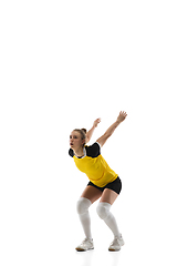 Image showing Young female volleyball player isolated on white studio background. Woman in sport\'s equipment training and practicing.