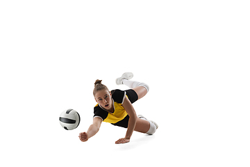 Image showing Young female volleyball player isolated on white studio background. Woman in sport\'s equipment training and practicing.