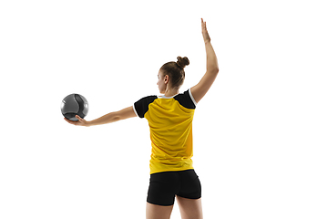 Image showing Young female volleyball player isolated on white studio background. Woman in sport\'s equipment training and practicing.