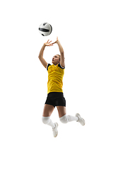 Image showing Young female volleyball player isolated on white studio background. Woman in sport\'s equipment training and practicing.