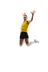 Image showing Young female volleyball player isolated on white studio background. Woman in sport\'s equipment training and practicing.